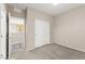 Bedroom featuring neutral walls, carpeted floors, closet, and a doorway to other rooms at 9277 Ardoa Ave, Las Vegas, NV 89148