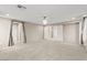 Airy bedroom with multiple doorways, providing easy access throughout the home at 9277 Ardoa Ave, Las Vegas, NV 89148
