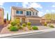 Charming two-story home with a well-manicured front yard and inviting curb appeal at 9277 Ardoa Ave, Las Vegas, NV 89148