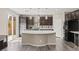 Modern kitchen with large island, stainless steel appliances, and stylish backsplash at 9277 Ardoa Ave, Las Vegas, NV 89148