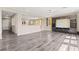 Open living area with hardwood floors connecting to other living spaces in the home at 9277 Ardoa Ave, Las Vegas, NV 89148