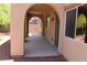 Covered back patio featuring stucco columns, brick wall, and concrete flooring at 932 Tafalla Ct, Las Vegas, NV 89138