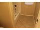 Modest bathroom featuring a bathtub with tile flooring and a window at 932 Tafalla Ct, Las Vegas, NV 89138