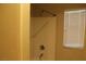 Standard bathroom with shower, window, and neutral color palette at 932 Tafalla Ct, Las Vegas, NV 89138