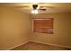 Standard bedroom with carpet, ceiling fan and natural light from the window at 932 Tafalla Ct, Las Vegas, NV 89138
