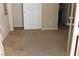 A bedroom with carpet floors and a closet door at 932 Tafalla Ct, Las Vegas, NV 89138