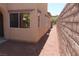 Home exterior shows side yard with low maintenance landscaping and block wall at 932 Tafalla Ct, Las Vegas, NV 89138