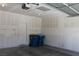 Spacious two car garage with ample room for parking and storage with an automatic garage door at 932 Tafalla Ct, Las Vegas, NV 89138