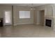 Living room with tiled flooring, and a fireplace at 932 Tafalla Ct, Las Vegas, NV 89138