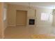 Spacious living room featuring neutral paint, tile floors, and a fireplace at 932 Tafalla Ct, Las Vegas, NV 89138