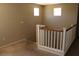 Loft with brown carpet and white wood railing at 932 Tafalla Ct, Las Vegas, NV 89138