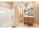 Well-lit bathroom featuring a shower-tub combo, and single sink vanity, offering a functional and clean space at 9343 Clear Day Ln, Las Vegas, NV 89178