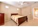Tranquil bedroom with wood furniture and multiple windows providing ample natural light and a cozy atmosphere at 9343 Clear Day Ln, Las Vegas, NV 89178