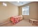Inviting bedroom with natural light and minimal decor featuring a twin bed and small desk at 9343 Clear Day Ln, Las Vegas, NV 89178