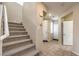 Entryway with tile flooring, stairs with carpet, and multiple entry doors at 9343 Clear Day Ln, Las Vegas, NV 89178