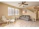 Inviting living room featuring neutral décor, tile flooring, and a ceiling fan, creating a cozy atmosphere at 9343 Clear Day Ln, Las Vegas, NV 89178