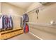 Spacious walk-in closet with shelving and ample hanging space, offering lots of storage for clothes and accessories at 9343 Clear Day Ln, Las Vegas, NV 89178