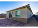 Backyard view featuring a brick patio and desert landscaping at 9428 Noble Fir Ridge Ave, Las Vegas, NV 89143