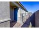 Home entrance with brick-paved walkway and wrought iron gate at 9428 Noble Fir Ridge Ave, Las Vegas, NV 89143