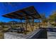 Picturesque view of the park offering shaded picnic areas and scenic walking paths with native trees at 9428 Noble Fir Ridge Ave, Las Vegas, NV 89143