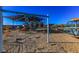 Community playground with swings, slides, and a shaded canopy, offering a fun and safe environment for children at 9428 Noble Fir Ridge Ave, Las Vegas, NV 89143