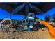 Playground equipment with a large climbing structure and slide under a sunshade canopy at 9428 Noble Fir Ridge Ave, Las Vegas, NV 89143