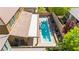Aerial view of a home featuring a pristine pool, covered patio, landscaping, and backyard oasis at 9519 Wild Valley Ave, Las Vegas, NV 89148