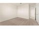 Bedroom featuring neutral carpeting, white walls, and a doorway at 9519 Wild Valley Ave, Las Vegas, NV 89148