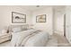 Serene bedroom with neutral colors, comfortable bed, and minimalist decor creating a peaceful atmosphere at 9519 Wild Valley Ave, Las Vegas, NV 89148