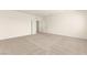 Spacious bedroom with neutral carpeting and white trim, featuring a double door entry at 9519 Wild Valley Ave, Las Vegas, NV 89148