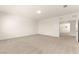 Expansive carpeted bedroom with ample natural light and white trim throughout at 9519 Wild Valley Ave, Las Vegas, NV 89148
