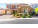 Attractive two-story home with a well-manicured front yard and a two-car garage at 9519 Wild Valley Ave, Las Vegas, NV 89148