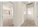 Well-lit carpeted hallway providing access to various rooms within the house at 9519 Wild Valley Ave, Las Vegas, NV 89148