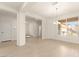 Open living area with wood floors, a modern chandelier, and bright natural light at 9519 Wild Valley Ave, Las Vegas, NV 89148
