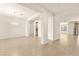 Bright and open-concept living area with wood floors and modern chandelier at 9519 Wild Valley Ave, Las Vegas, NV 89148