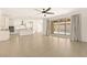 Open-concept space with a view of the kitchen and patio area with pool from living room at 9519 Wild Valley Ave, Las Vegas, NV 89148