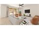 Stylish living room featuring modern furnishings, a large screen television, and access to the outdoor area at 9519 Wild Valley Ave, Las Vegas, NV 89148