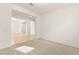 Spacious room featuring soft carpet that flows into an open space, with pristine wood flooring at 9519 Wild Valley Ave, Las Vegas, NV 89148