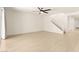 Expansive living room with hardwood floors, leading to staircase and offers a flexible living space at 9519 Wild Valley Ave, Las Vegas, NV 89148