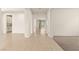 Spacious living area with light wood floors and neutral walls, leading to the backyard at 9519 Wild Valley Ave, Las Vegas, NV 89148