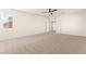 Large carpeted loft area featuring a ceiling fan and recessed lighting at 9519 Wild Valley Ave, Las Vegas, NV 89148