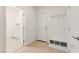 Welcoming mudroom features a convenient bench with storage and an adjacent laundry area at 9519 Wild Valley Ave, Las Vegas, NV 89148