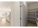 A walk-in pantry provides ample storage space just off the kitchen at 9519 Wild Valley Ave, Las Vegas, NV 89148