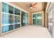 Relaxing covered patio featuring sliding glass doors that open to the pool area at 9519 Wild Valley Ave, Las Vegas, NV 89148