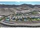 A panoramic view showcasing several luxury homes with private pools in a scenic hillside community at 10 Olympia Outlook Dr, Las Vegas, NV 89141
