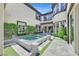 Private courtyard featuring an elegant water feature, mature landscaping, and access to main living areas at 10 Olympia Outlook Dr, Las Vegas, NV 89141