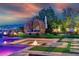 Beautiful outdoor oasis with pool, firepit, and comfortable lounge area with city views at 10 Olympia Outlook Dr, Las Vegas, NV 89141