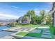 Backyard with a pool, fire pit, seating and lush landscaping, creating an inviting outdoor oasis at 10 Olympia Outlook Dr, Las Vegas, NV 89141