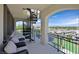 Charming balcony showcasing a spiral staircase, seating, and a breathtaking city view at 10 Olympia Outlook Dr, Las Vegas, NV 89141