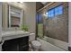 Bathroom with modern fixtures, and a shower-tub combination with a stylish mosaic tile surround at 10 Olympia Outlook Dr, Las Vegas, NV 89141